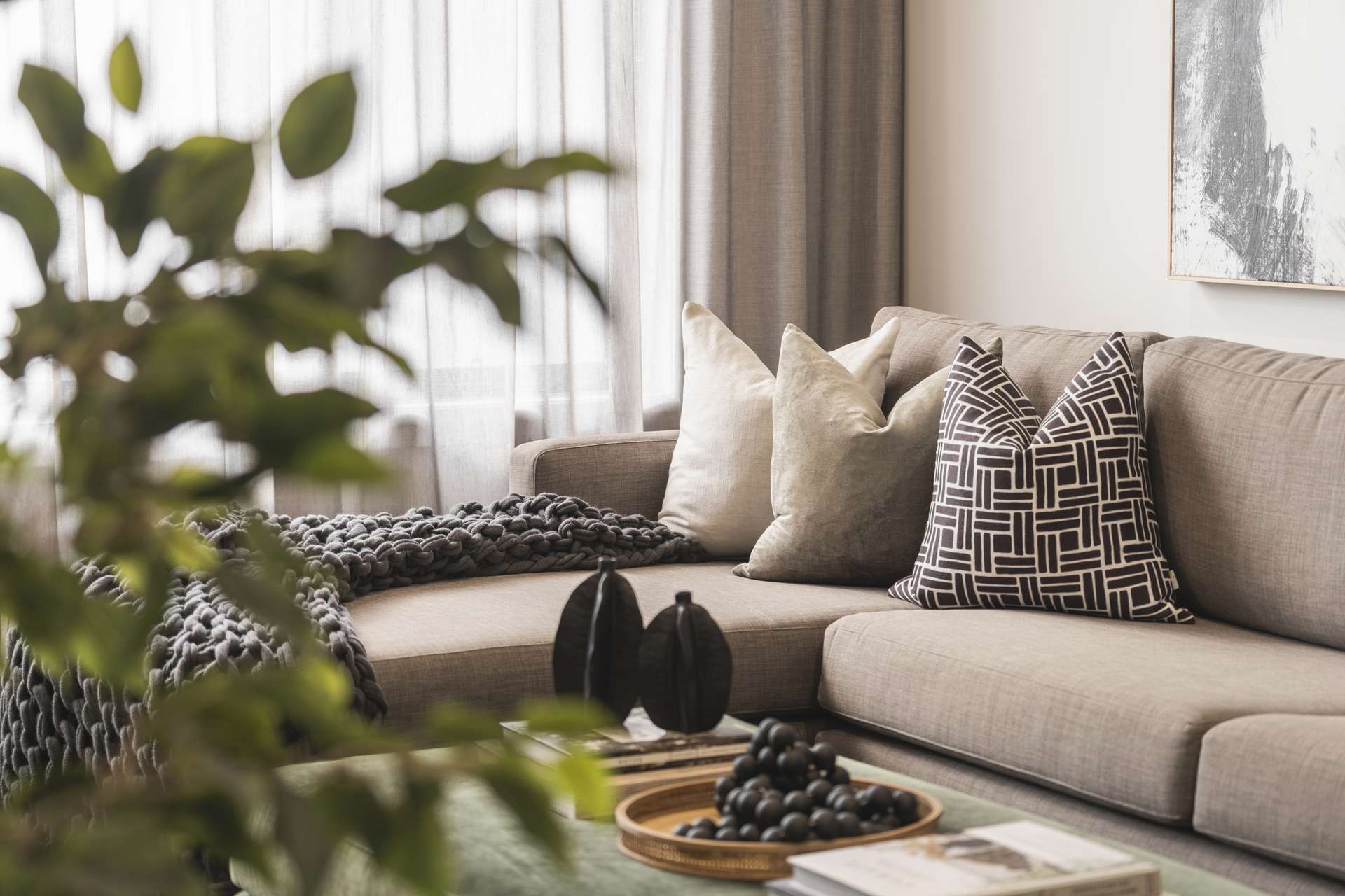 Lounge with shear curtains and indoor plant