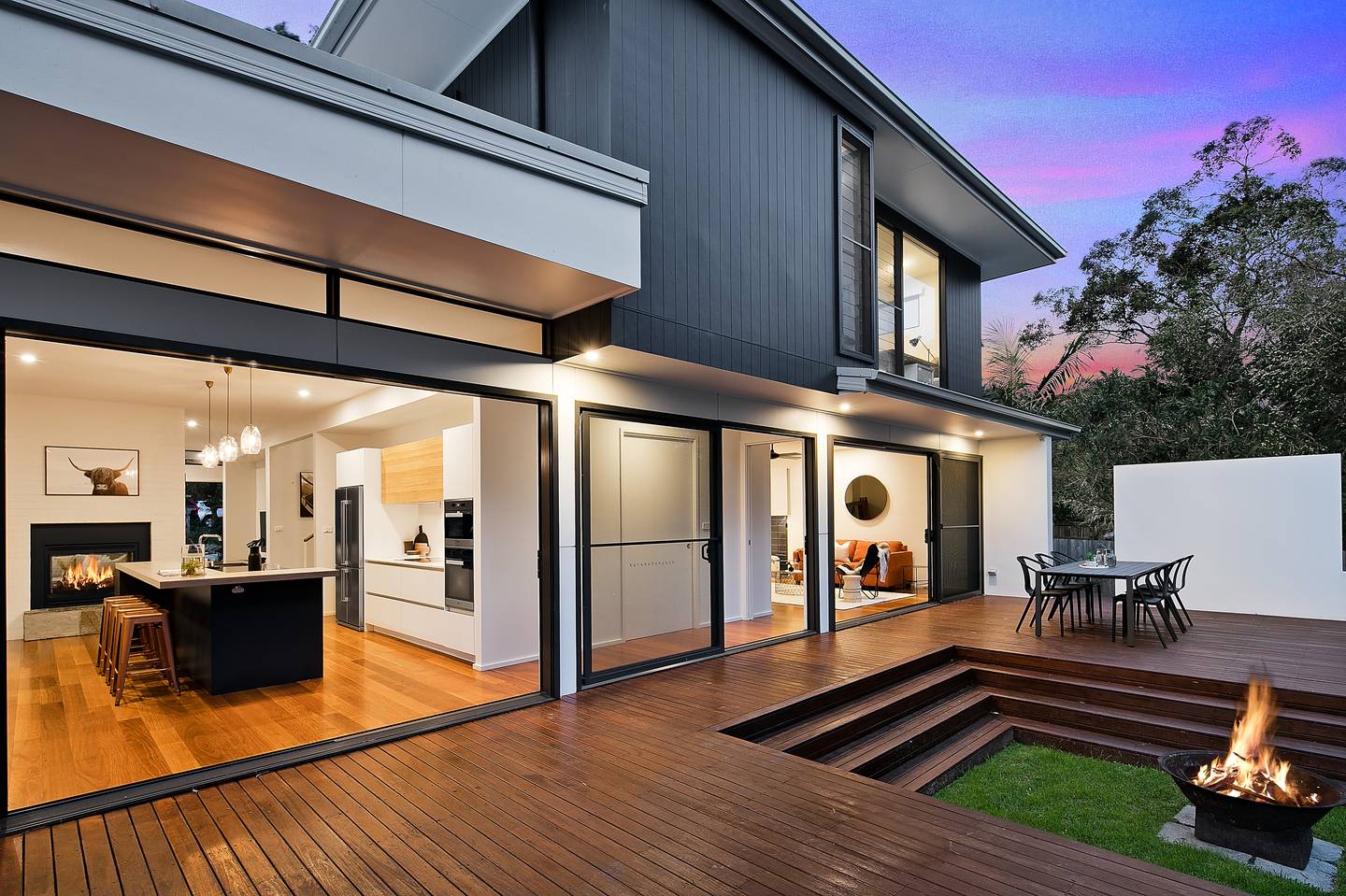 Modern Australian alfresco with decking and firepit