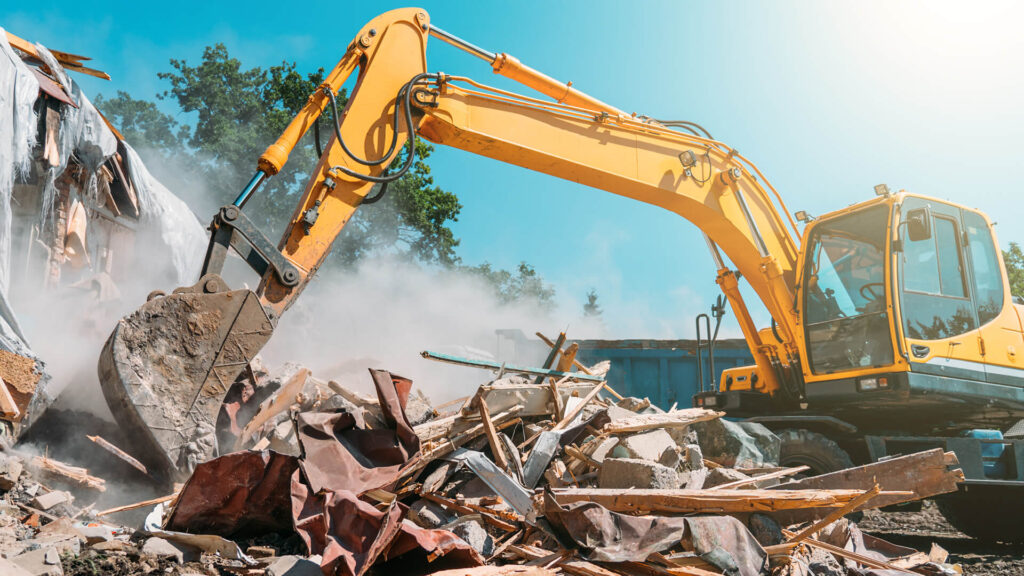 Excavator demolishing old home for knock down rebuild