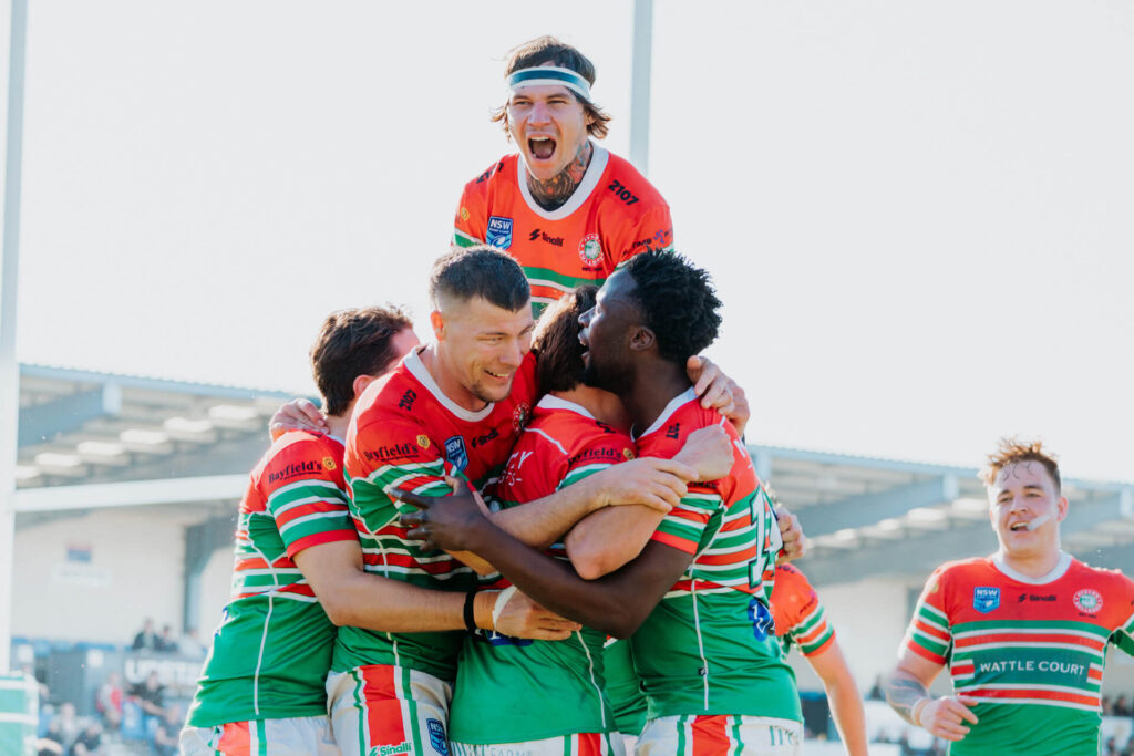 William 'Kelso' Kelly celebrates a try with the team