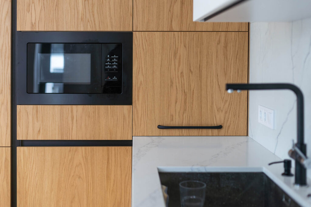 Timber kitchen cabinetry with with integrated appliances